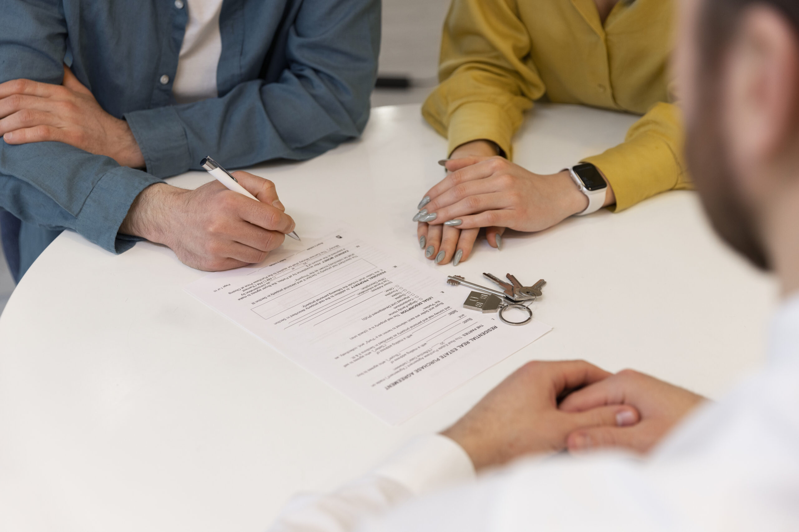 male-real-estate-agent-doing-business-showing-house-potential-buying-couple